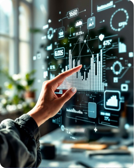 Person working at dual monitors in front of a world map mural